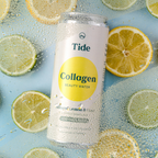 A can of Tide Collagen Beauty Water sparkling lemon and lime flavored collagen drink, surrounded by fresh lemon and lime slices on a light blue background with condensation droplets.
